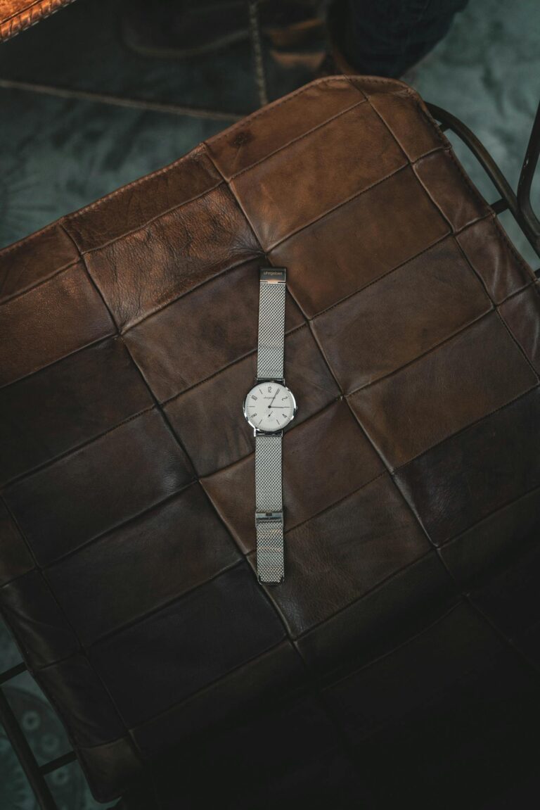 Round Silver-colored Watch on Table